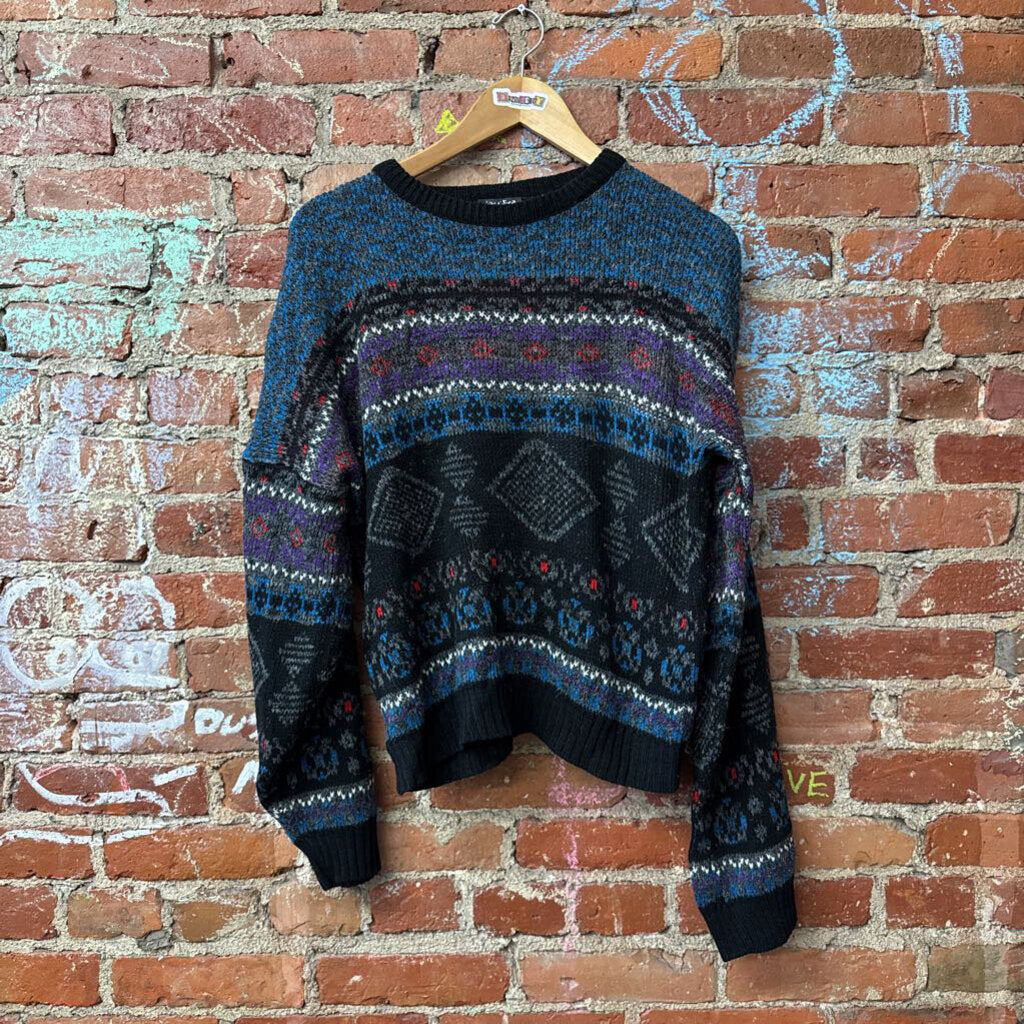 Colorful vintage knitwear in Diversity Consignment's gender-inclusive assortment