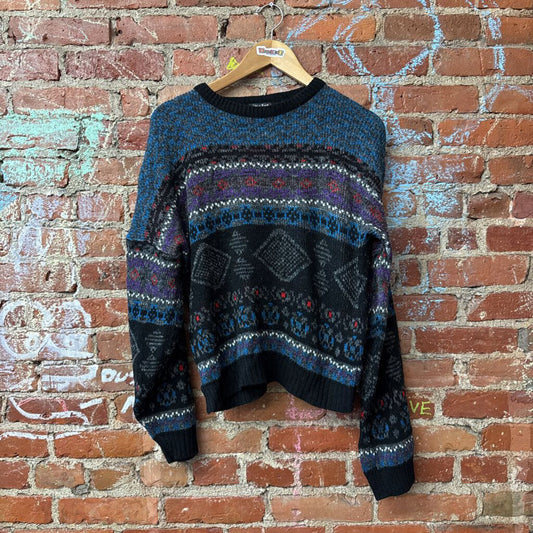 Colorful vintage knitwear in Diversity Consignment's gender-inclusive assortment