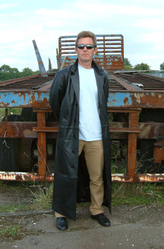 Modern black trench coat demonstrating the long belted trench silhouette