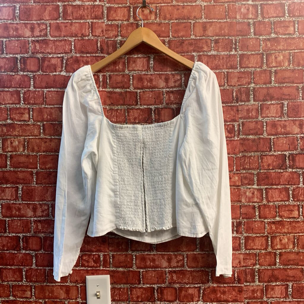 Reformation white linen zip-back blouse detail view