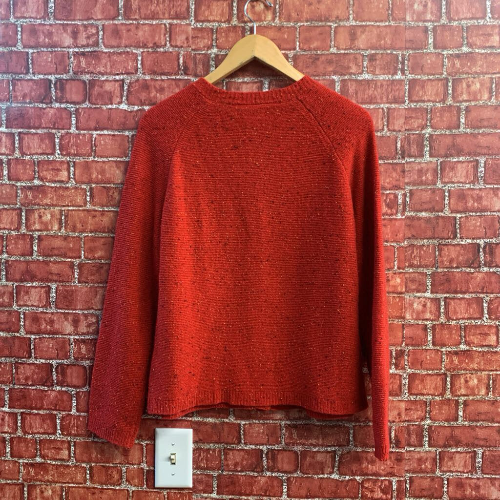 Tabitha Webb red sweater, colorful button and label detail