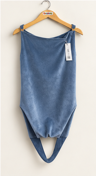 Akira grey blue faux suede open back top on warm off white editorial background
