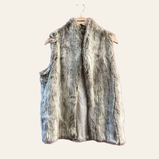 BCBG grey faux fur vest on warm off white editorial background