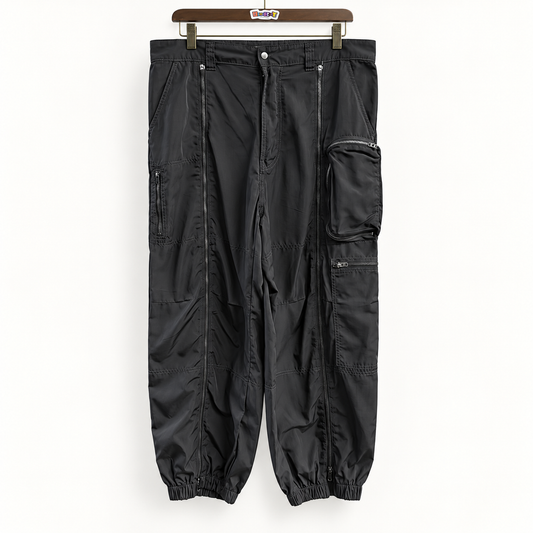 BDG black nylon cargo pants on off white background