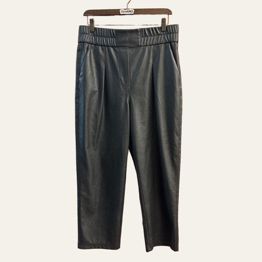 Brochu Walker black pleather pants on off white background