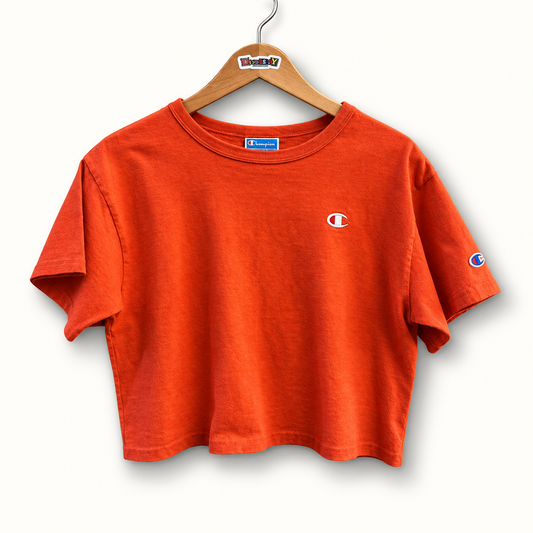 Champion orange crop tee on off white editorial background