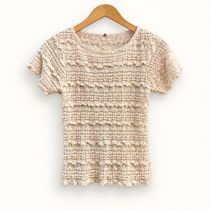 Free People pink beige popcorn mesh top on off white editorial background