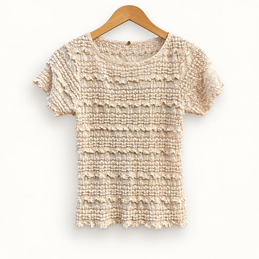Free People pink beige popcorn mesh top on off white editorial background