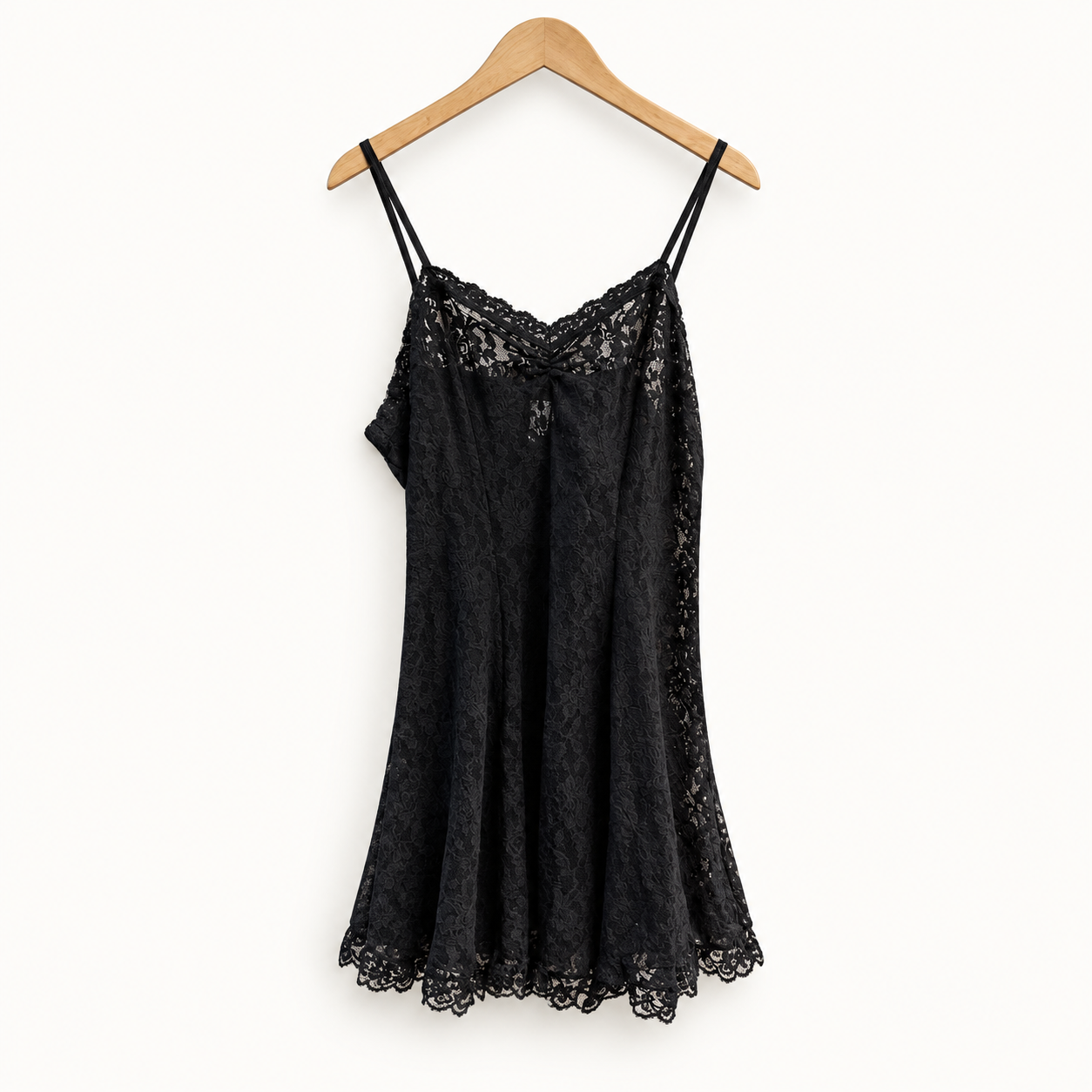 Hanky Panky black lace mini dress on off white editorial background