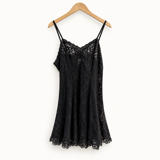 Hanky Panky black lace mini dress on off white editorial background