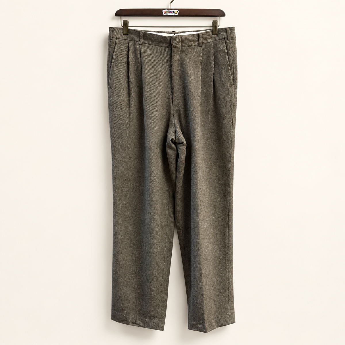 LL Bean vintage brown wool tweed trousers on warm off white editorial background