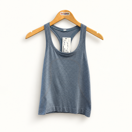Lululemon blue striped athletic tank on off white editorial background
