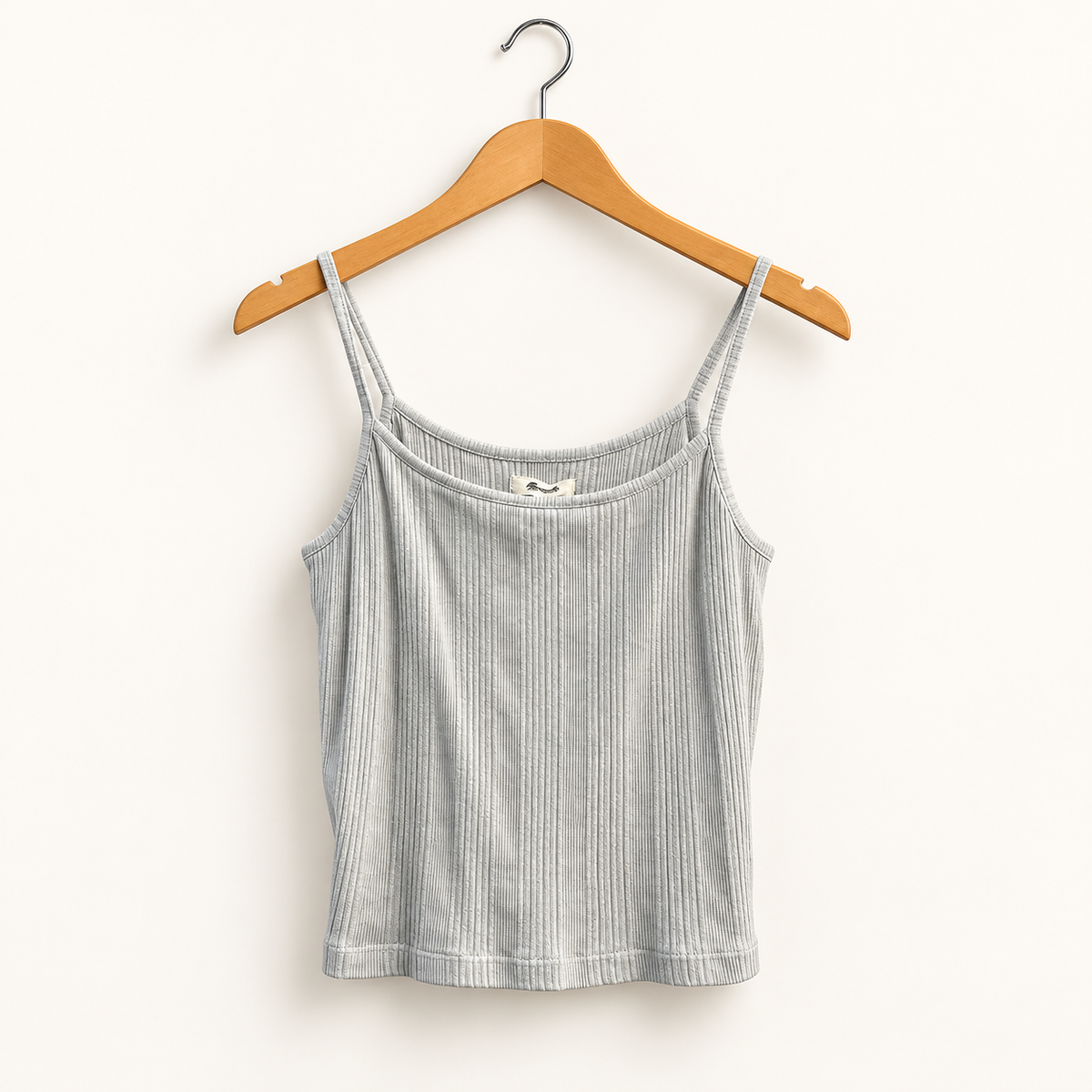 Madewell sage green ribbed tank top on warm off white editorial background