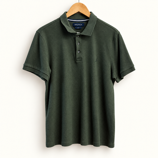 Nautica dark green polo on off white editorial background