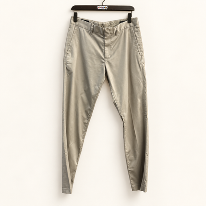Nordstrom khaki trousers on warm off white editorial background