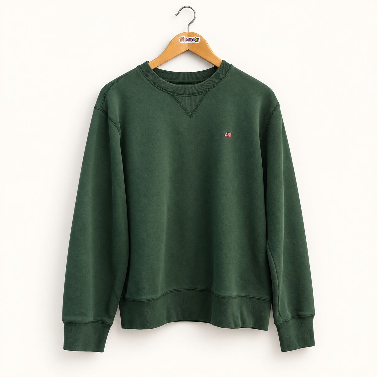 Polo Jeans Co dark green vintage crewneck sweatshirt on warm off white editorial background