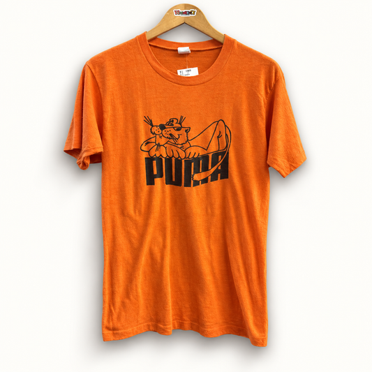 Puma vintage orange and black tee on off white editorial background