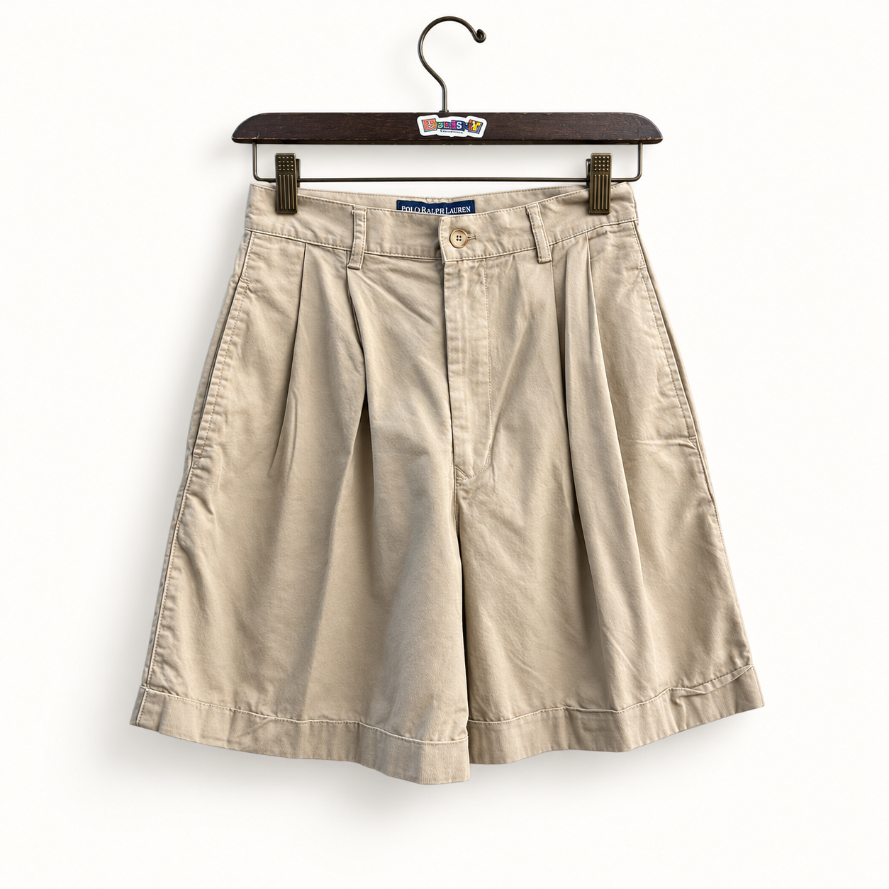 Ralph Lauren Sport khaki pleated shorts on off white editorial background