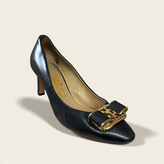 Salvatore Ferragamo Cheetah Pattern Bow Toe Heels on off-white editorial background