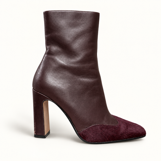 Steve Madden brown cow fur toe ankle boot on off white editorial background