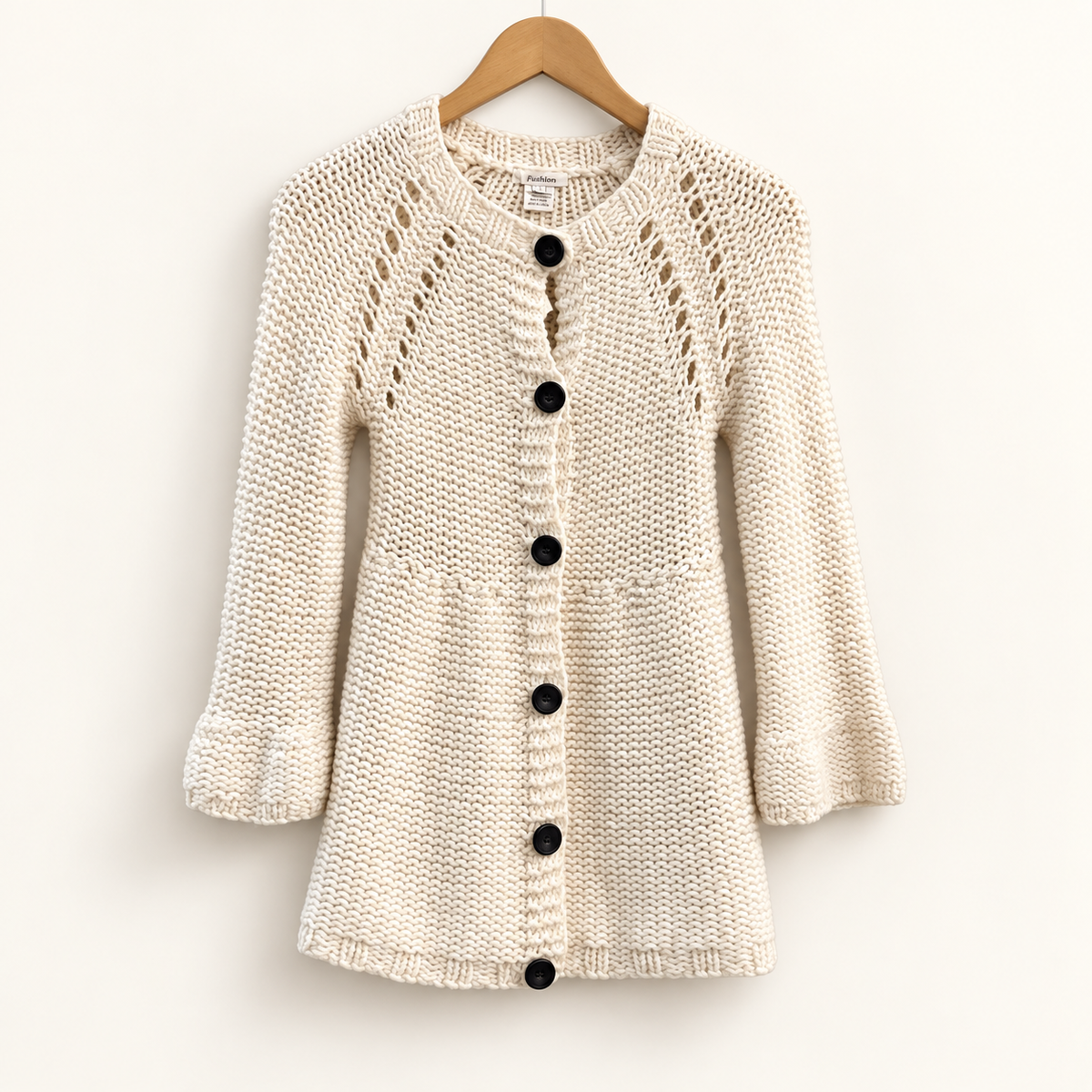 Sundance cream knit cardigan on warm off white editorial background