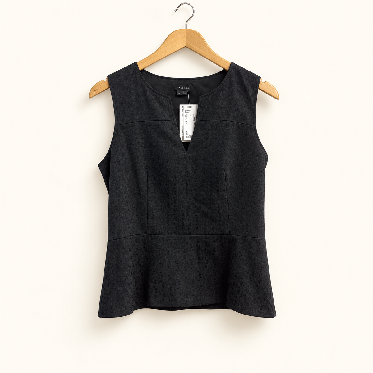 theory peplum blouse on off-white background