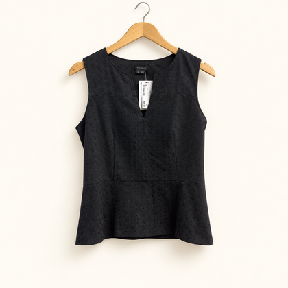 theory peplum blouse on off-white background