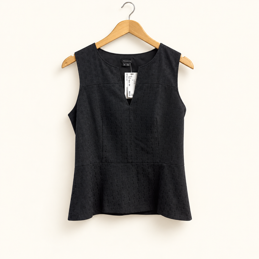 theory peplum blouse on off-white background