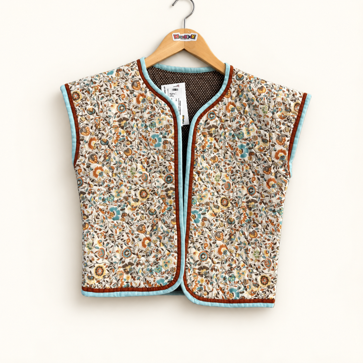 unbranded floral vest on off-white background
