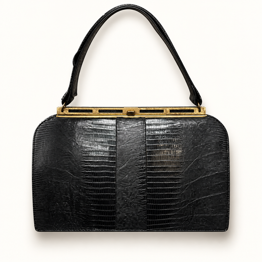 Vintage Beblestrone black lizard skin bag on off white editorial background