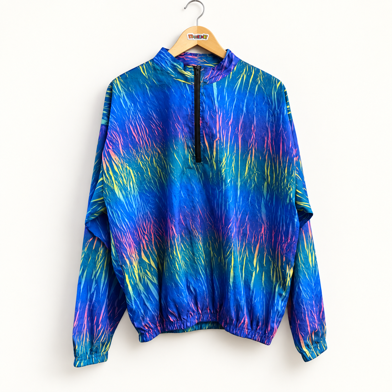 Vintage blue multicolor half zip windbreaker on off white editorial background